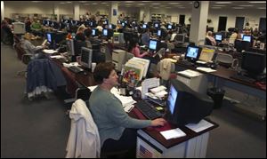 Barb Kravetsky, a 30-year employee of the Maritz Automotive Research Group, works in Maumee's data processing center. 