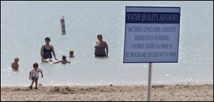 Health advisories posted on the Maumee Bay State Park beach have become a common sight in recent years. Biologists are seeking the source of bacteria that prompts the warnings.