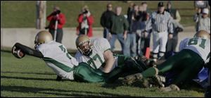 Josh Bicy reaches across the goal line for the two-point conversion that was the difference.