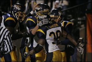 Trinity Dawson (38) is congratulated after running for a touchdown in the third quarter. Dawson ran for 170 yards last night.
