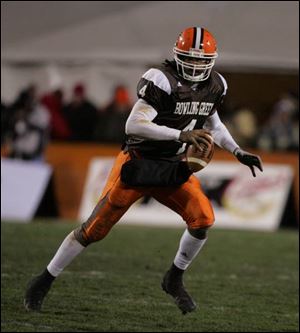BGSU quarterback Omar Jacobs looks for an open receiver after scrambling out of the pocket in the third quarter.
