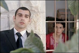 Kais Nashef, left, plays Said, who has been chosen for a martyr s
mission. Haim Abbass portrays Said s mother