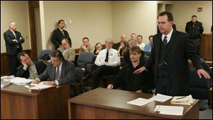 Neo-Nazi spokesman Bill White, standing, argued against an injunction sought by the city of Toledo barring assembly by the National Socialist Movement anywhere other than Government Center downtown today. Mr. White lost his argument.