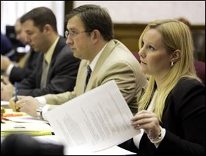 Assistant Huron County Prosecutor Jennifer DeLand questions a witness at a custody hearing for children adopted by Michael and Sharen Gravelle. The hearing continues today.