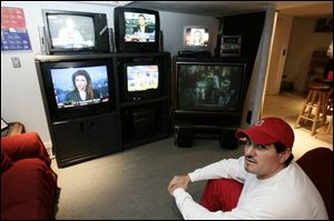 Steve Ramirez sits in front of his 