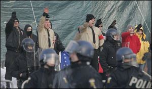 National Socialist Movement members rally in front of the Government Center.