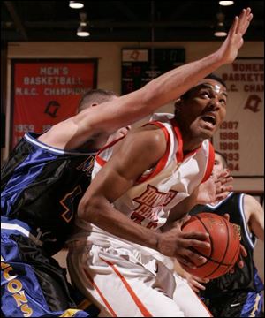 BGSU's Mawel Soler draws a bead on the basket as Matt Stoltz tries to defend.