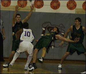 Clay's Brent Graham goes sprawling trying to guard Waite's Troy Murphy (10) as Andy Knopp and Dan Bachmayer help.