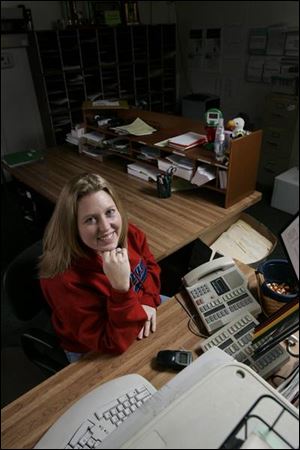 Chris Walendzak of Clay High School, who is expecting her first child, says her job gives her training for motherhood.