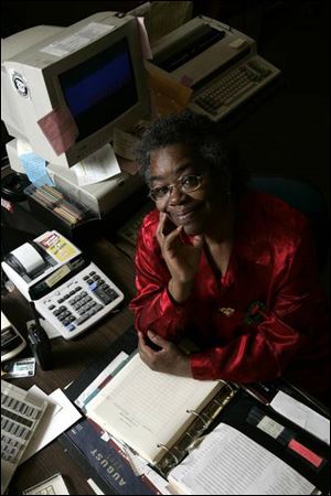 Mary Peterson is a secretary at Scott High School, the school from which five of her six children graduated.
