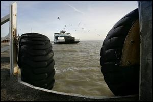 A Miller Boat Line ferry approaches Catawba Island from South Bass Island during an unusual winter run. The lack of ice prompted Miller and the Kelleys Island Ferry Boat Line to set sail with limited schedules for as long as the lake remains open. Boat operators can't recall the last time midwinter service was offered.