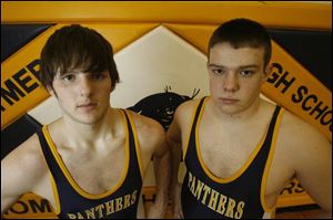 Tim Samson, left, was Whitmer's heavyweight at 235 pounds. Now he's competing at 171. Ryan Ernst is the current Panthers heavyweight at 240.