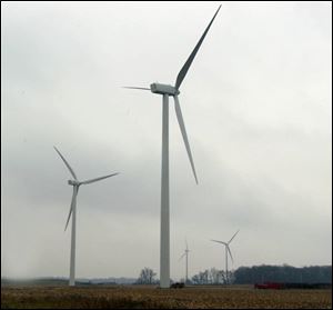 The turbines of Bowling Green's wind farm are visible from U.S. 6. Elmore
exploring
new form
of energy