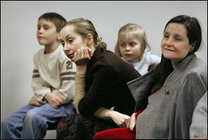 Natalie Scarlett, center front, attended with her mother, Christine, brother, Gabriel, and sister, Mary Catherine.