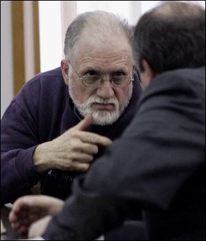 Jenna Gravelle's father, Michael Gravelle, confers with his lawyer.