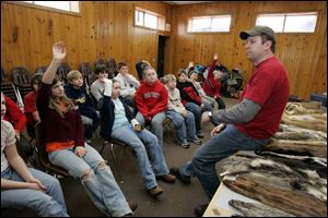 Outdoor education instructor Bob Lasko teaches the sixth graders about mammals.