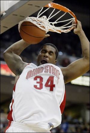 Ohio State's Terence Dials slams home a dunk for two of his game-high 22 points against 
Michigan. Dials, the main inside presence for the Buckeyes, also hauled in 11 rebounds.