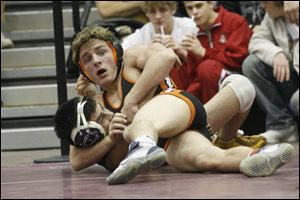 Liberty Center's 145-pound Marc Hoff gets headlock on Sandusky St. Mary's Christian Ortolani.