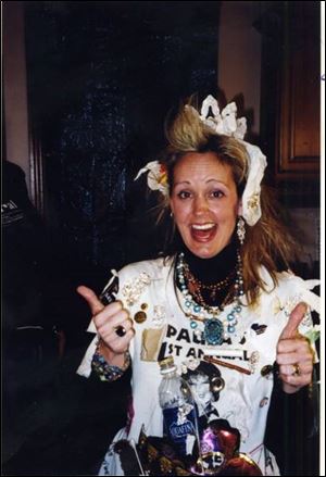 TWO THUMBS UP: Paula Enos signals satisfaction at the fun going on in the Hymels' home.