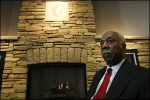 John C. Moore is the first African-American to serve as vice chair on the Owens Community College board of trustees.
