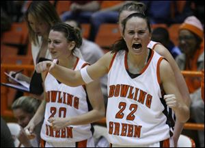 Kate Achter, left, and Ali Mann will be cheering again tonight if the Falcons can defeat Miami for an undefeated MAC season.

