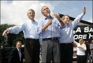 Sen. Mike Dewine, right, attending a 2004 rally with President Bush and Zell Miller in Ironton, Ohio, says when pople decide to vote for him, they are 'not electing George Bush ... they're electing me.'