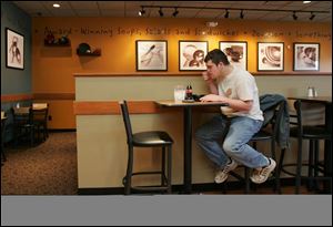 Jerry Head, of Maumee, has a lunch of chicken pot pie soup at Zoup! on Dussel Drive. 