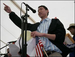
Andrew Jung, a 15-year-old freshman at Emmanuel Baptist High School whose parents were deported to South Korea, shared the story of his family at the FLOC rally yesterday.