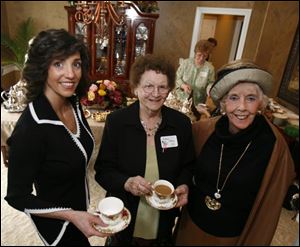 Sandra Seiple, left, Mildred Allred, and Jean Smith at the Opera Guild member tea.
