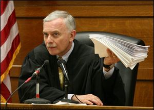 Judge Thomas Osowik sided with defense attorneys who argued that a prospective juror ought to be dismissed because of anti-Catholic statements that she made.