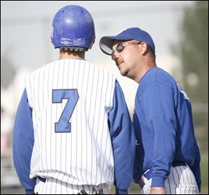Springfield coach Jamie Schwieterman talks to Tyler Ammons, who is hitting .389. 