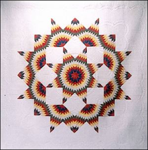Sylvania Township resident Sharon Mareska hopes her broken-star bed-sized quilt will come home a prize-winner. 