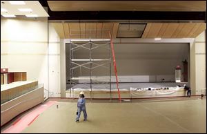 Cecelia Adams, a member of the Toledo Public Schools  community oversight committee, takes a walk through the auditorium of the new Rogers High.