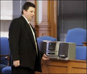 Assistant Lucas County Prosecutor Robert Miller plays a tape of a message Bob McCloskey left
for EJS Properties LLC. The ex-councilman was accused of seeking money from the developer.
