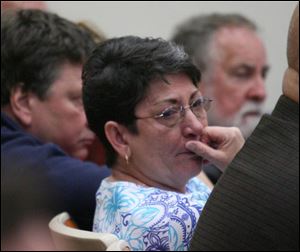 Barbara Robinson, sister-in-law of the Rev. Gerald Robinson, listens to the guilty verdict and sentence in the 1980 murder.
