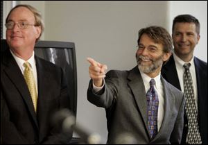 Assistant prosecutors Chris Anderson, left, and Dean Mandros enjoy some banter during a
press conference following the verdict yesterday. Mr. Mandros was lead prosecutor in the case.
