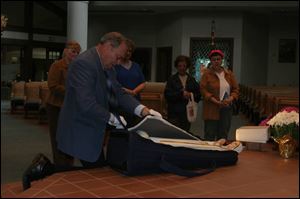 Carl Marlburg has escorted the statue around the world since 1985.
