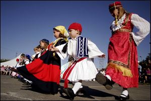 
A group of children participates in an ethnic dance at last year s Greek-American Festival at Holy Trinity Orthodox Cathedral in Toledo. The festival, slated for Sept. 8-10 this year, is a celebration of the Orthodox faith and Greek culture. 

