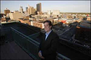 The roof of the Bartley Lofts condominiums, where Blade staff writer Christopher D. Kirkpatrick resides, features a swimming pool but also provides an impressive view of downtown Toledo s skyline.
