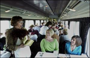 Dana Fields Sell entertains passengers on the Blissfield-based Old Road Dinner Train.
