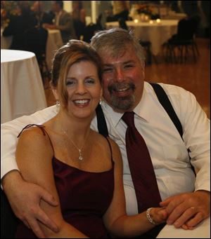 CHAMPAGNE TO BLAME? Kristy and Harold Caldwell snuggle at the Blame the Champagne event.