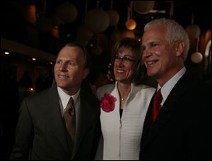 LEGAL EAGLES: Steve Smith, left, Janine Avila, and Steve Collier enjoy the party hosted by Connelly, Jackson, and College, one of the few remaining preparties.