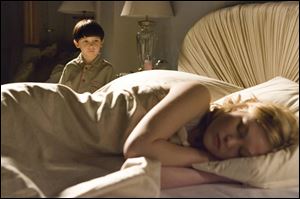 Watched by her son, Damien (Seamus Davey-Fitzpatrick), the sleeping Katherine Thorn (Julia Stiles) has no idea
of the depths of evil inside the lad.
