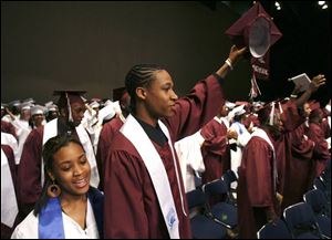 Grant Maxey, with his girlfriend, LaTrina Moore, bids farewell to Scott High School during Monday's commencement. He will attend Jackson State University in Mississippi.