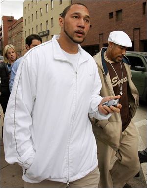 Steelers Charlie Batch, left, and Mike Logan leave Pittsburgh s Mercy Hospital.
