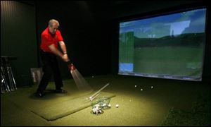 Denny Nimigean, who's confident he'll get golf clubs, gets in some practice at U.S. Golf in Sylvania.