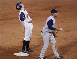 Toledo's Kevin Hooper stands on the second base bag, but it's not his to keep after he was called out attempting to steal.