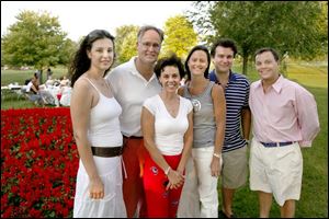 GOOD KNIGHTS: From left, Fatima Knight, Tony Knight, Debbie Knight, Lisa Martin, Rupert Martin, and Ryan Knight pose for a family portrait at Belmont Country Club.