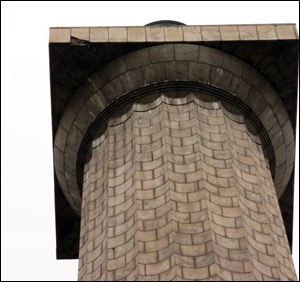 The 500-pound piece of granite fell more than 300 feet from the facing of the observation deck, toward the upper left corner above, and left a 2 -foot crater in the plaza.
