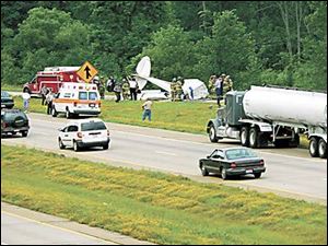 A single-engine plane piloted by a young Lorain County man crashed after striking power lines.